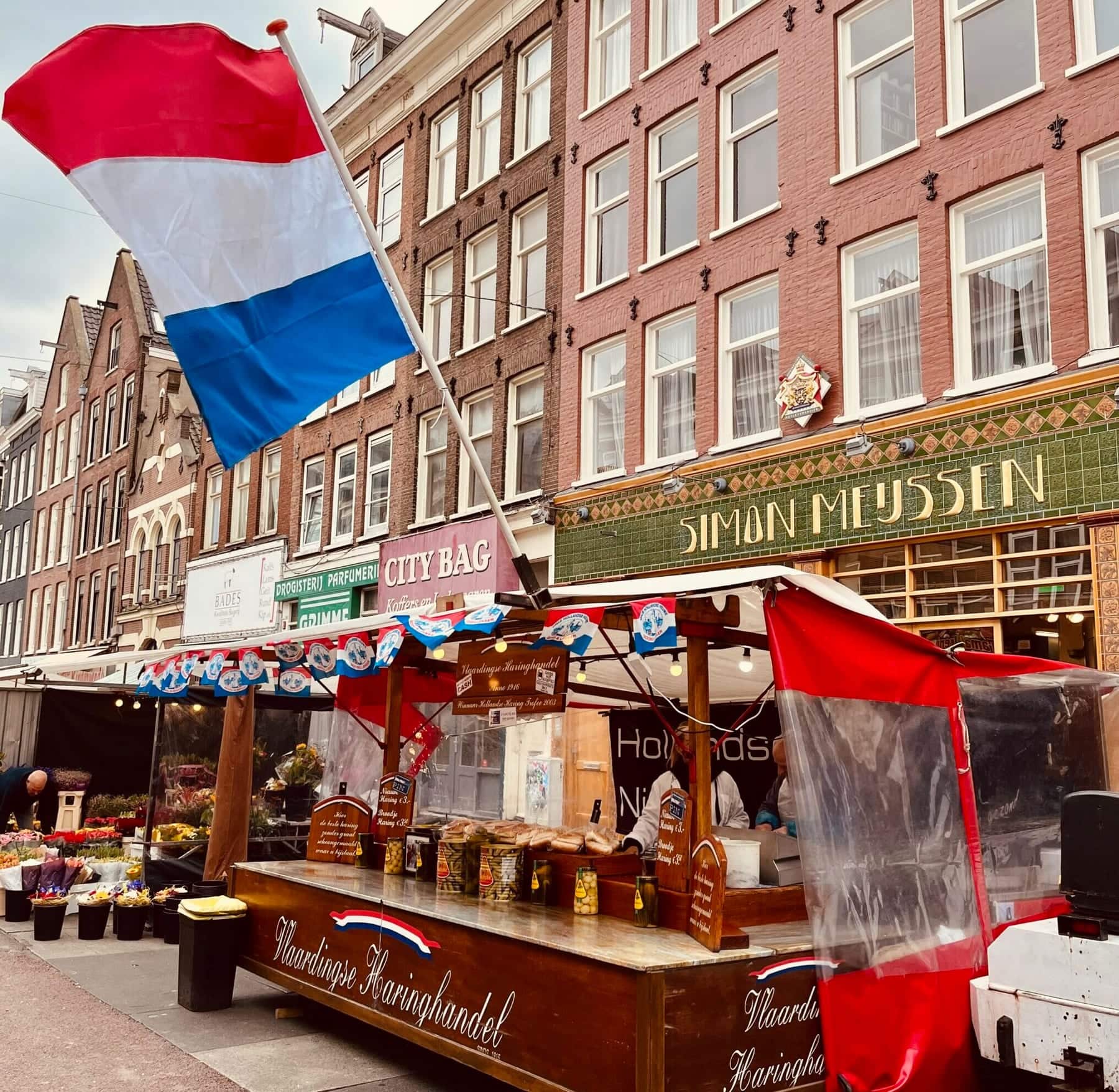 A herring stall under a Dutch flag on the Albert Cuypmarkt